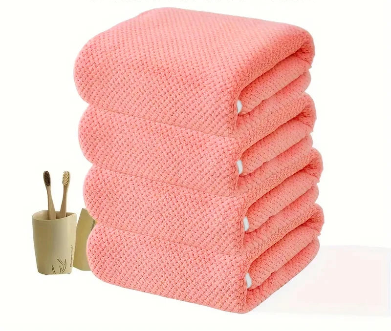 Vier übereinanderliegende Badetücher in Soft Rose mit weicher Oberfläche